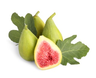 Cut and whole green figs with leaves isolated on white