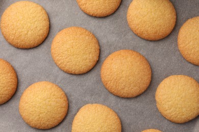 Delicious Danish butter cookies on baking tray, flat lay