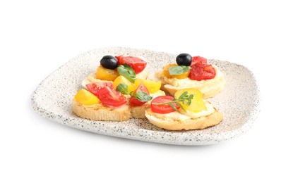 Plate of delicious tomato bruschettas on white background