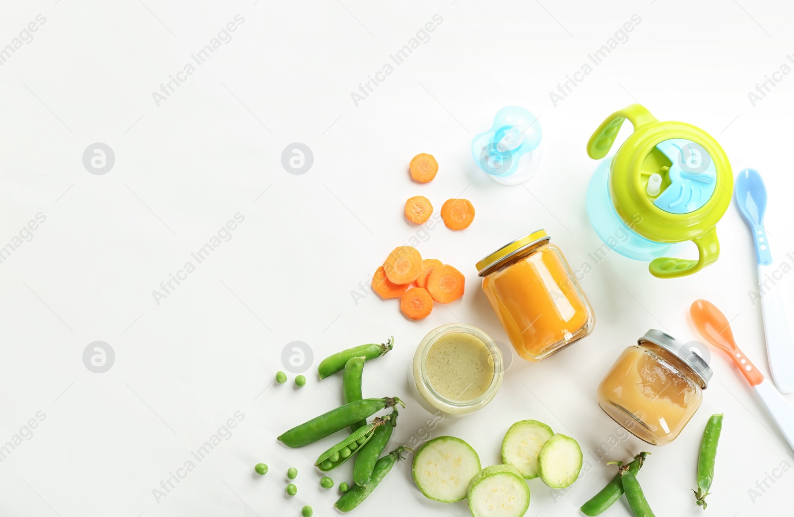 Photo of Flat lay composition with baby food, ingredients and accessories on light background