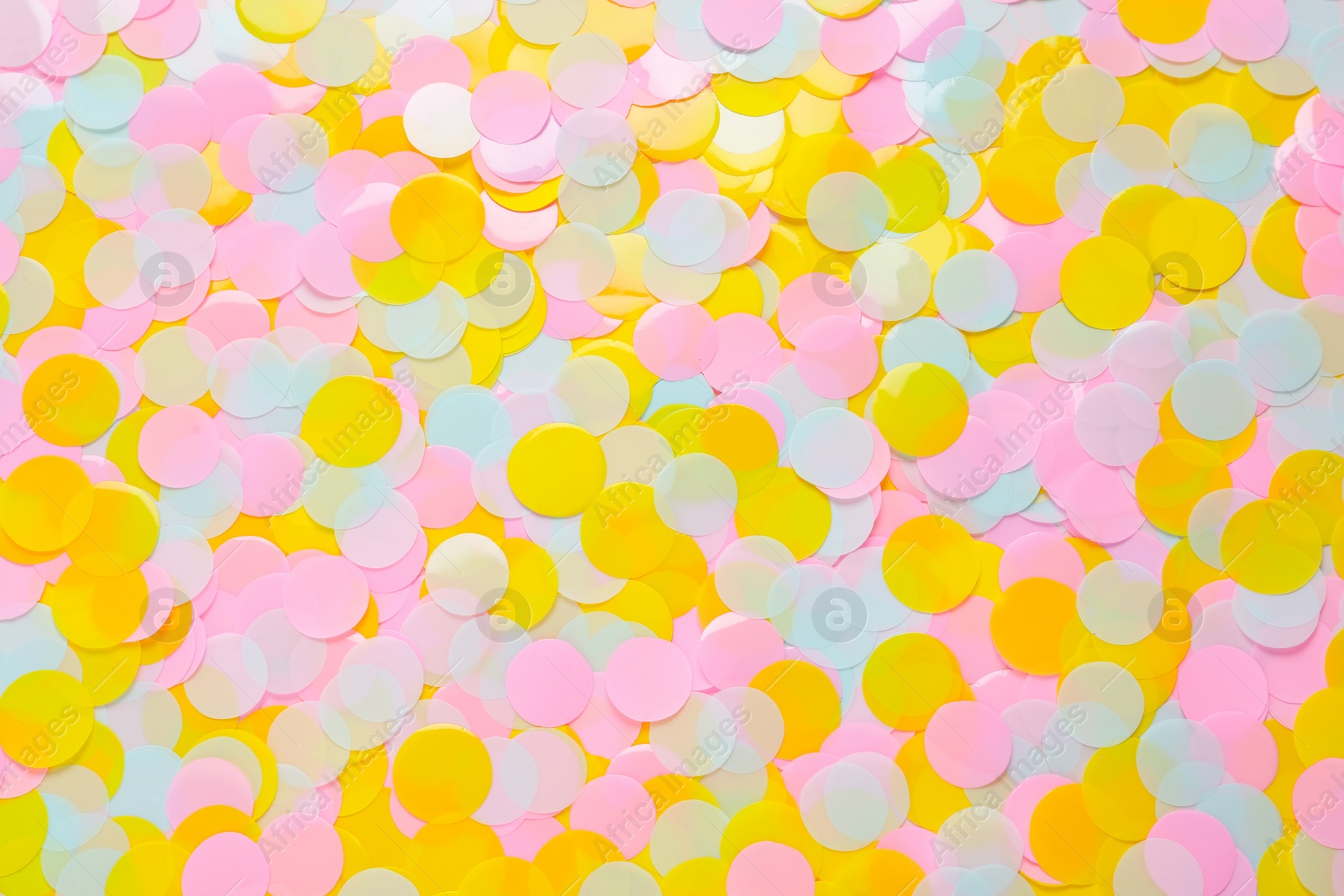 Photo of Bright colorful confetti as background, top view