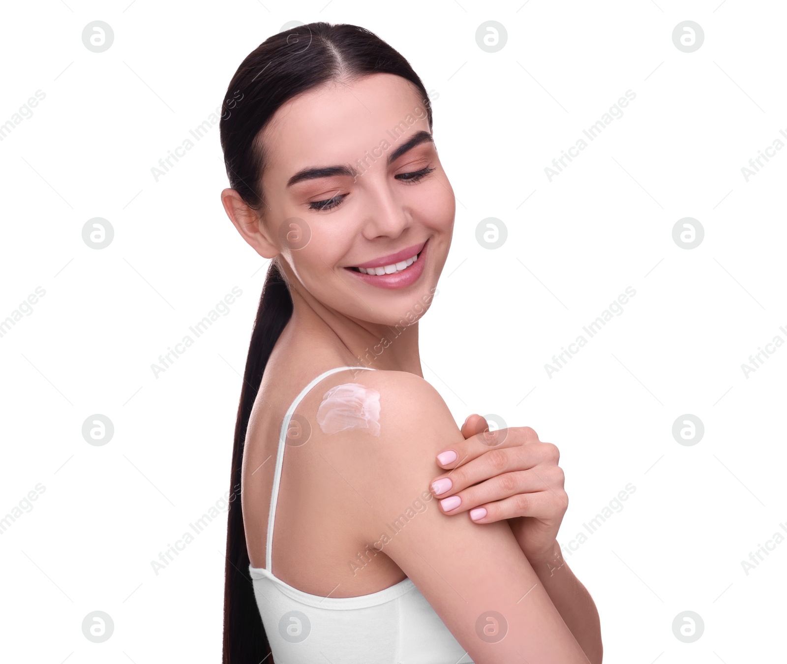 Photo of Beautiful woman with smear of body cream on her shoulder against white background