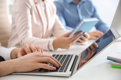 Photo of Business people working at table, closeup. Professional communication