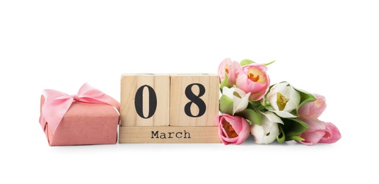 Photo of Wooden block calendar with date 8th of March, tulips and gift box on white background. International Women's Day