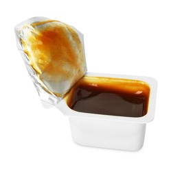 Photo of Tasty barbecue sauce in plastic container isolated on white