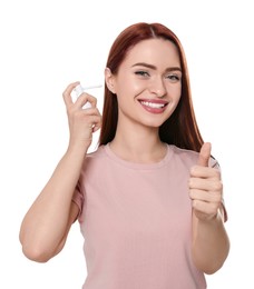 Photo of Woman using ear spray on white background