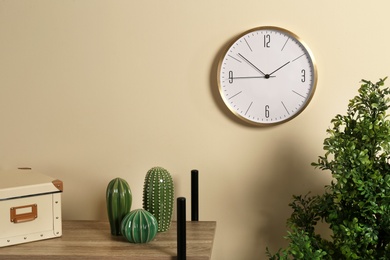 Photo of Room interior with clock and space for text on wall. Time management