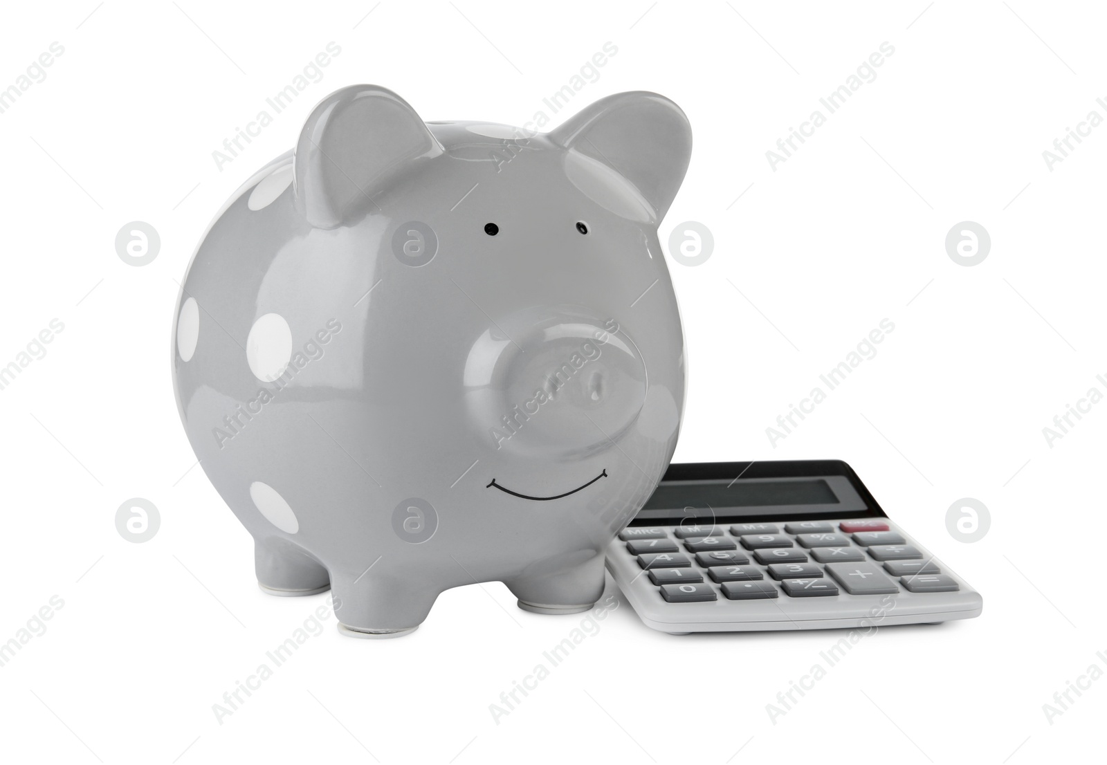 Photo of Calculator and grey piggy bank isolated on white