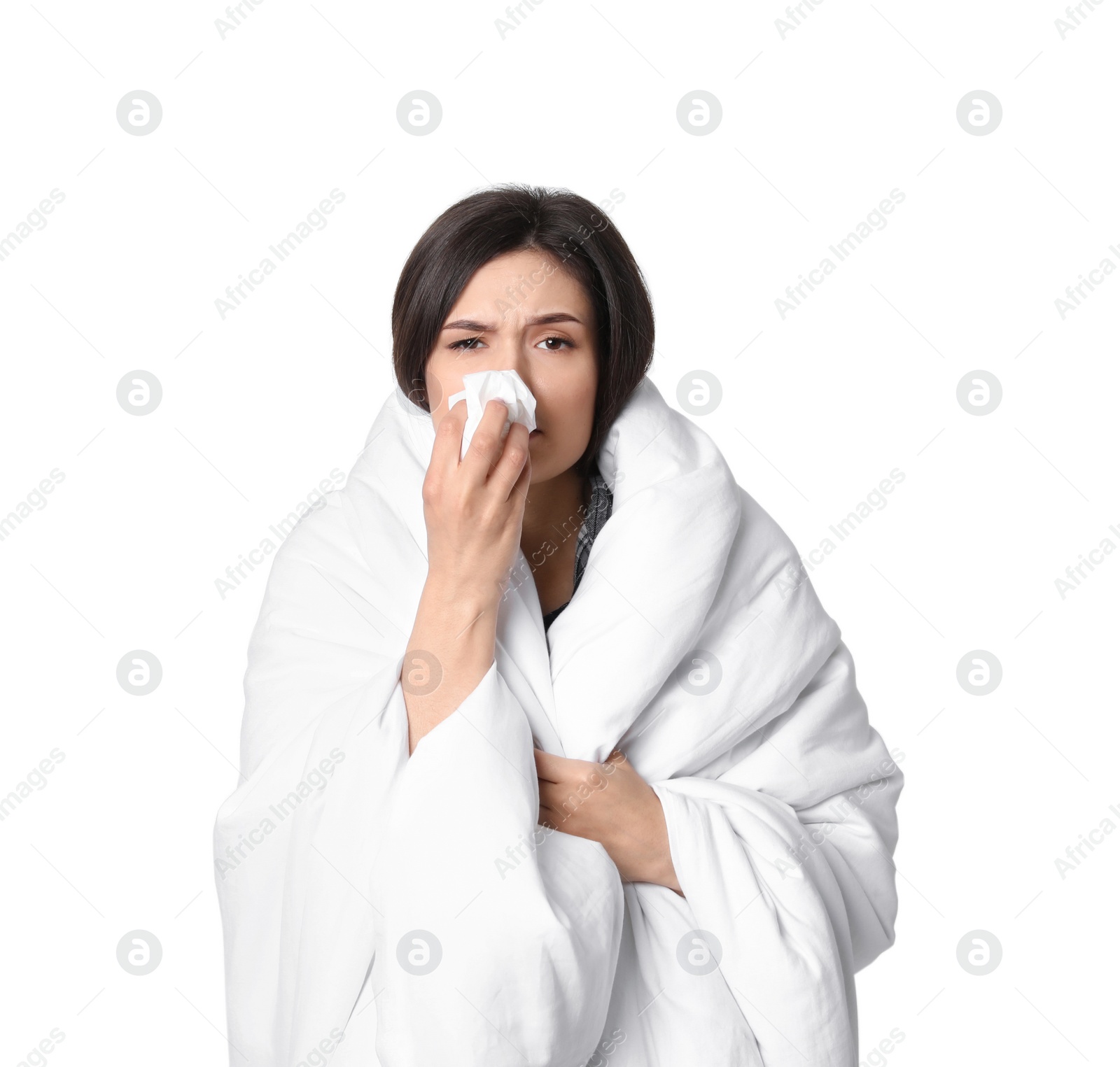 Photo of Young woman wrapped in blanket  suffering from cold on white background