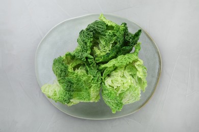 Photo of Fresh ripe Chinese cabbages on light grey table, top view