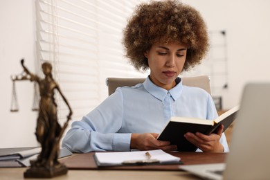 Notary with notebook at workplace in office