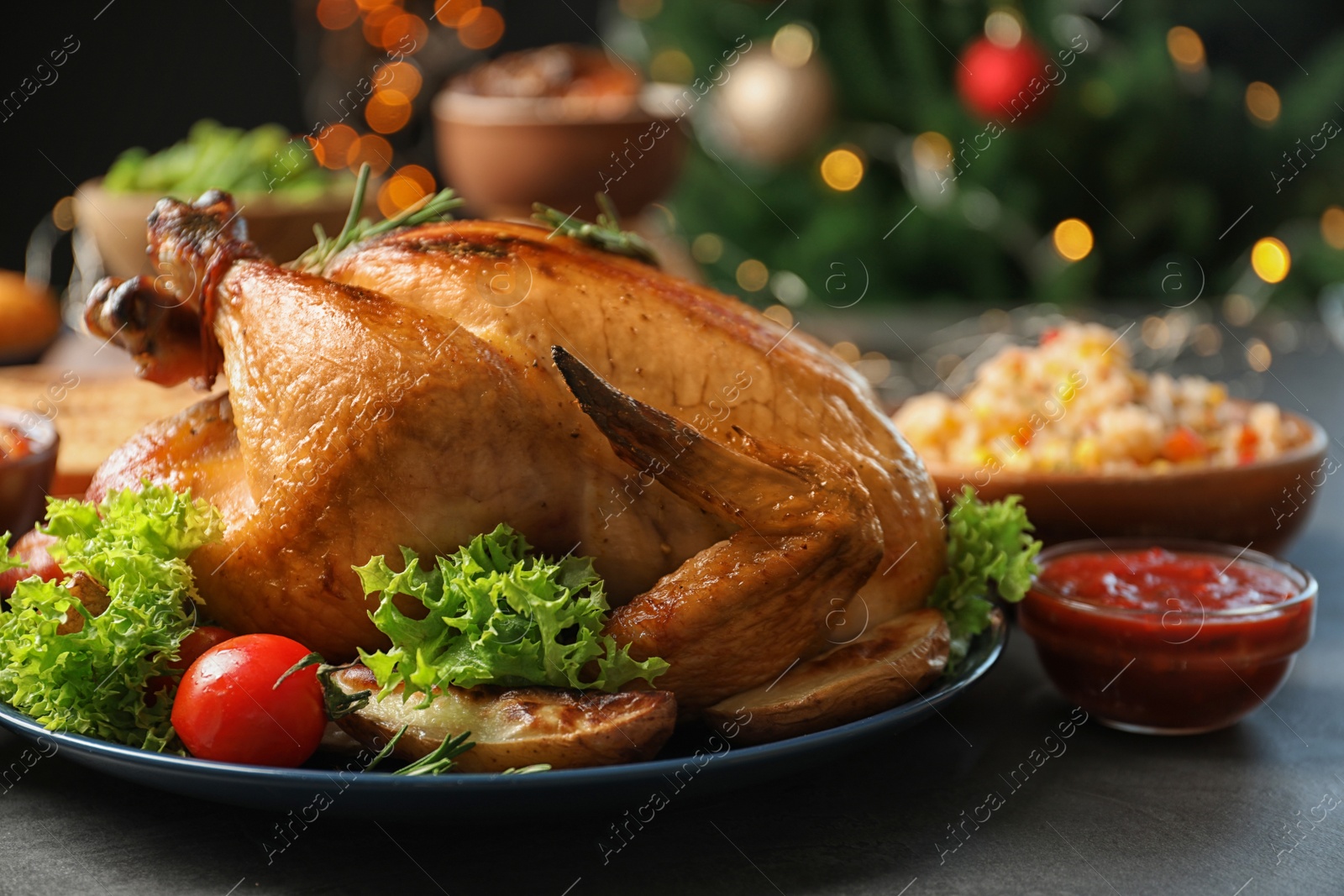 Photo of Traditional festive dinner with delicious roasted turkey served on table