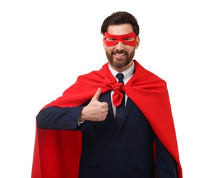 Photo of Happy businessman in red superhero cape and mask showing thumb up on white background