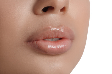 Photo of Young woman with beautiful full lips on white background, closeup