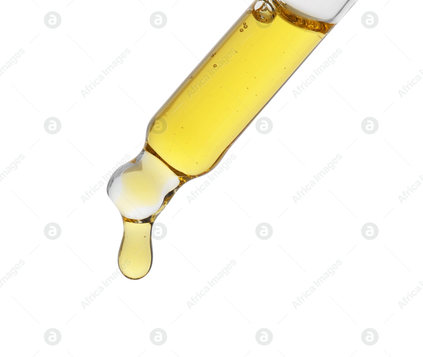 Photo of Dripping tincture from pipette isolated on white