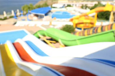 Photo of Blurred view from colorful slides in water park