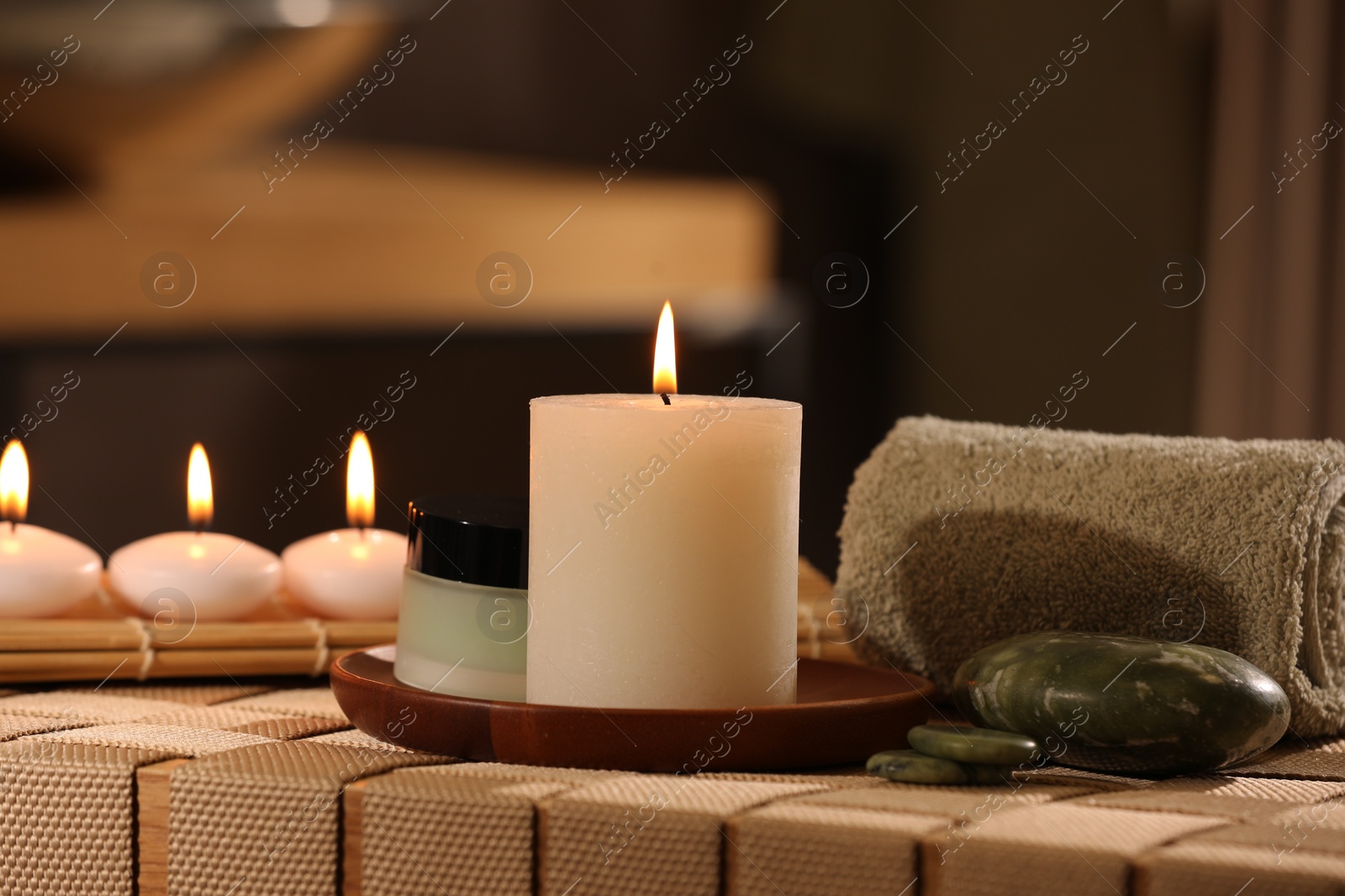 Photo of Beautiful composition with different spa products on wicker bench indoors