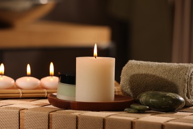 Beautiful composition with different spa products on wicker bench indoors
