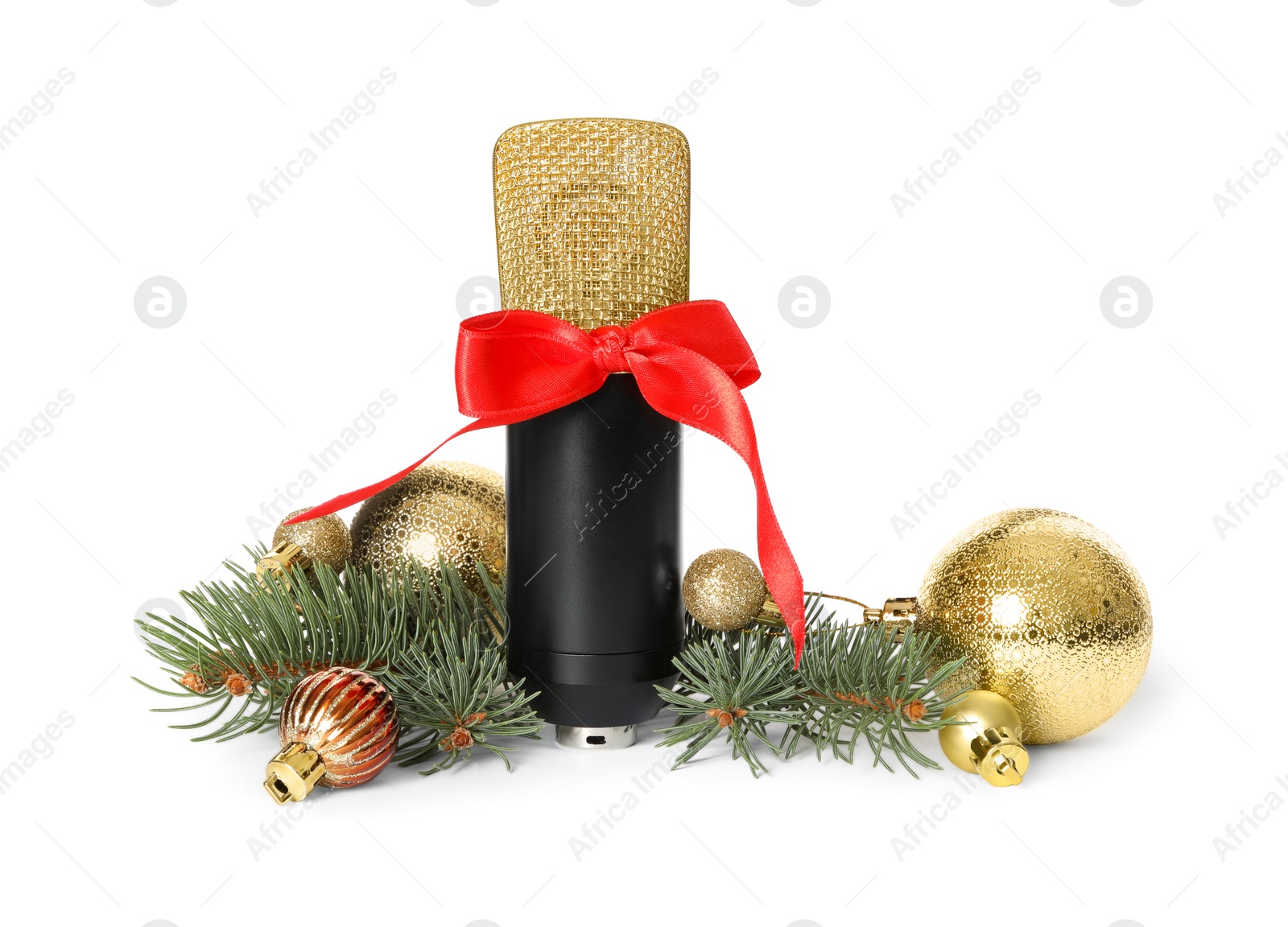 Photo of Microphone with red bow and festive decor on white background. Christmas music