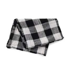 Black checkered tablecloth on white background, top view