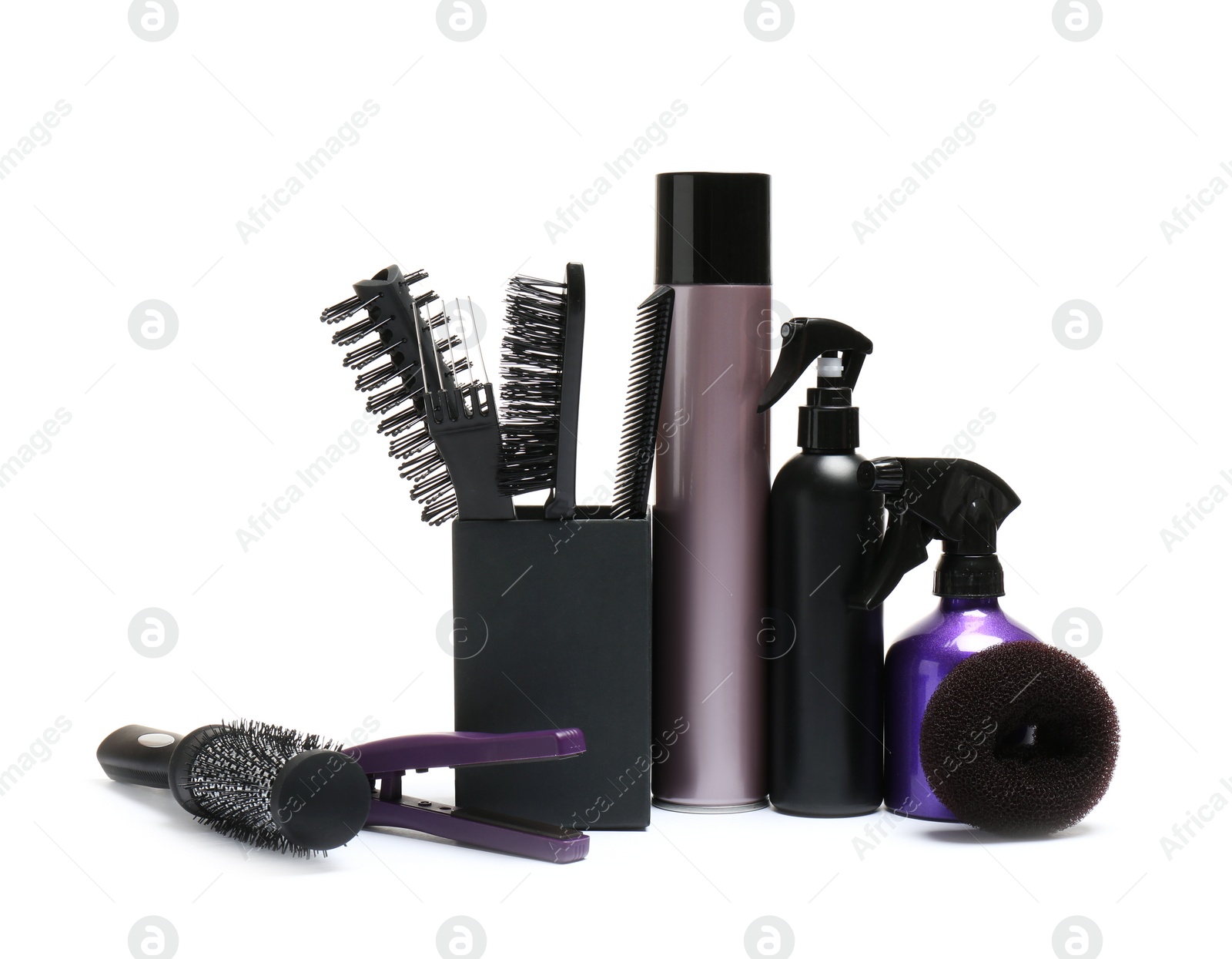 Photo of Set of professional hairdresser's tools on white background