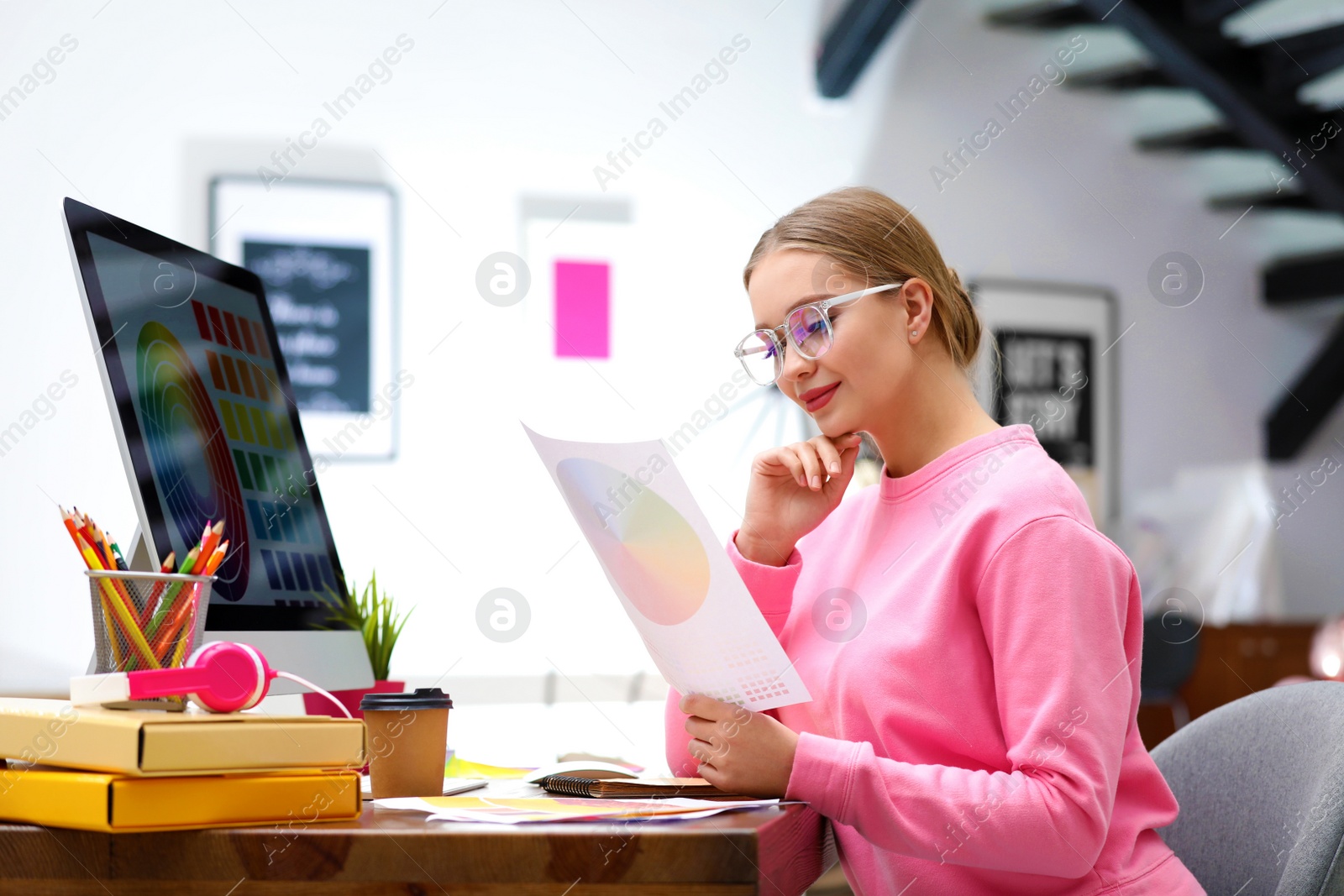 Photo of Professional designer working with computer at table in office