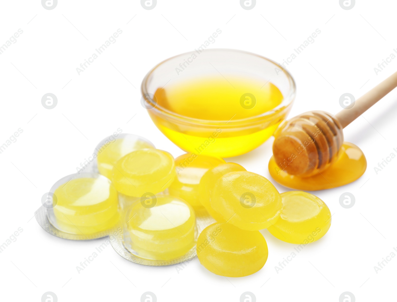 Photo of Many color cough drops and honey on white background