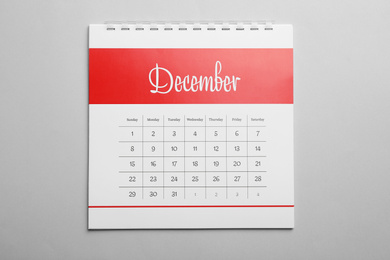 December calendar on light grey background, top view