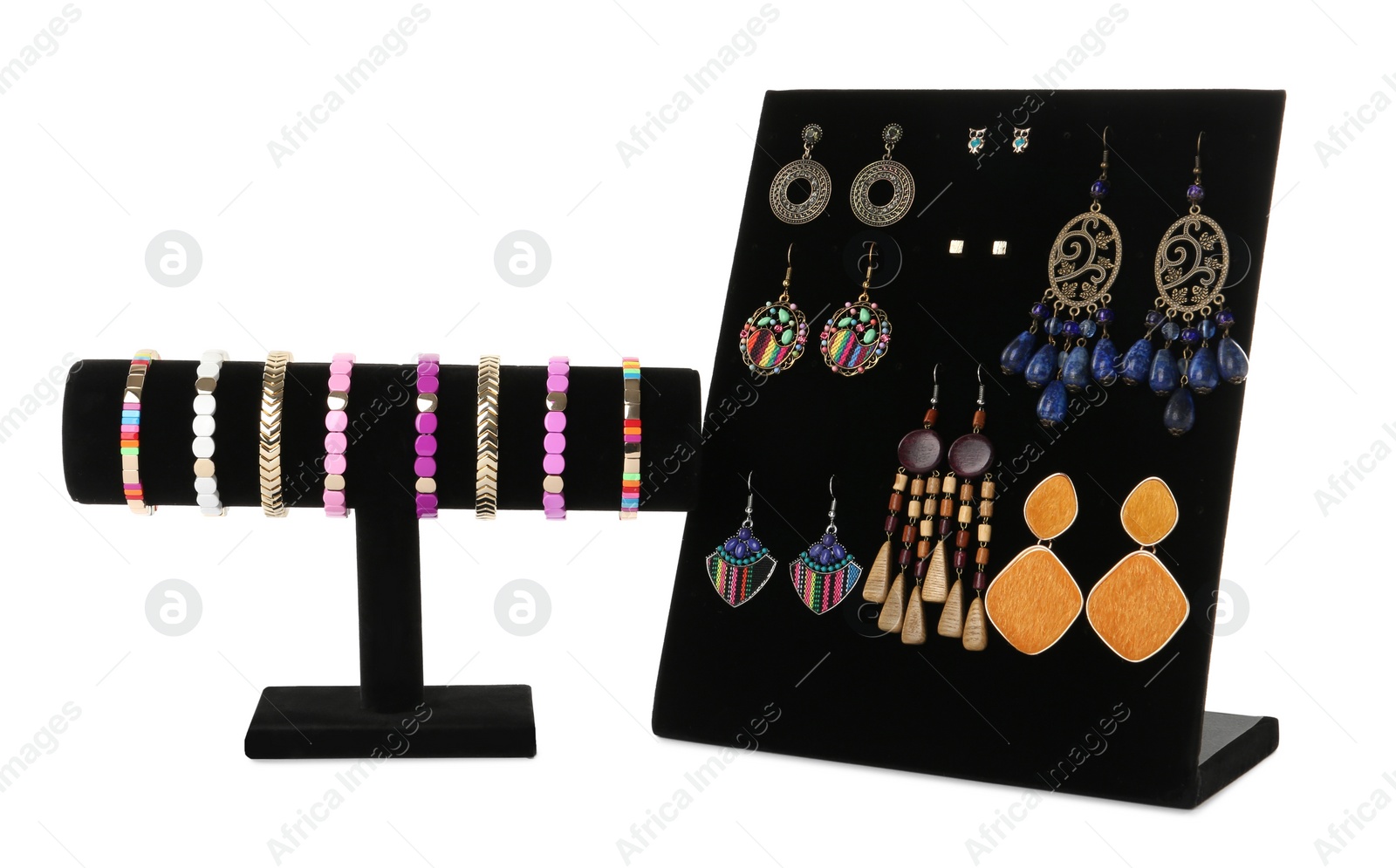 Photo of Different display stands with stylish jewelry on white background