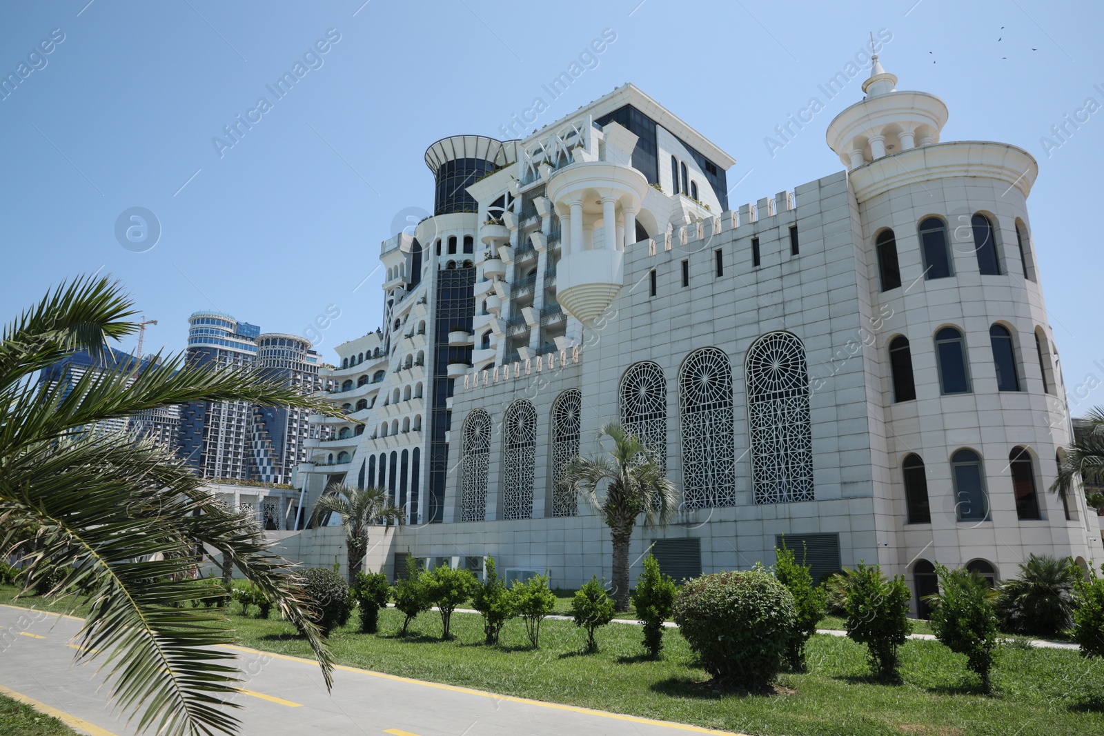 Photo of BATUMI, GEORGIA - JUNE 10, 2022: Beautiful view of Grand Gloria Hotel on sunny day