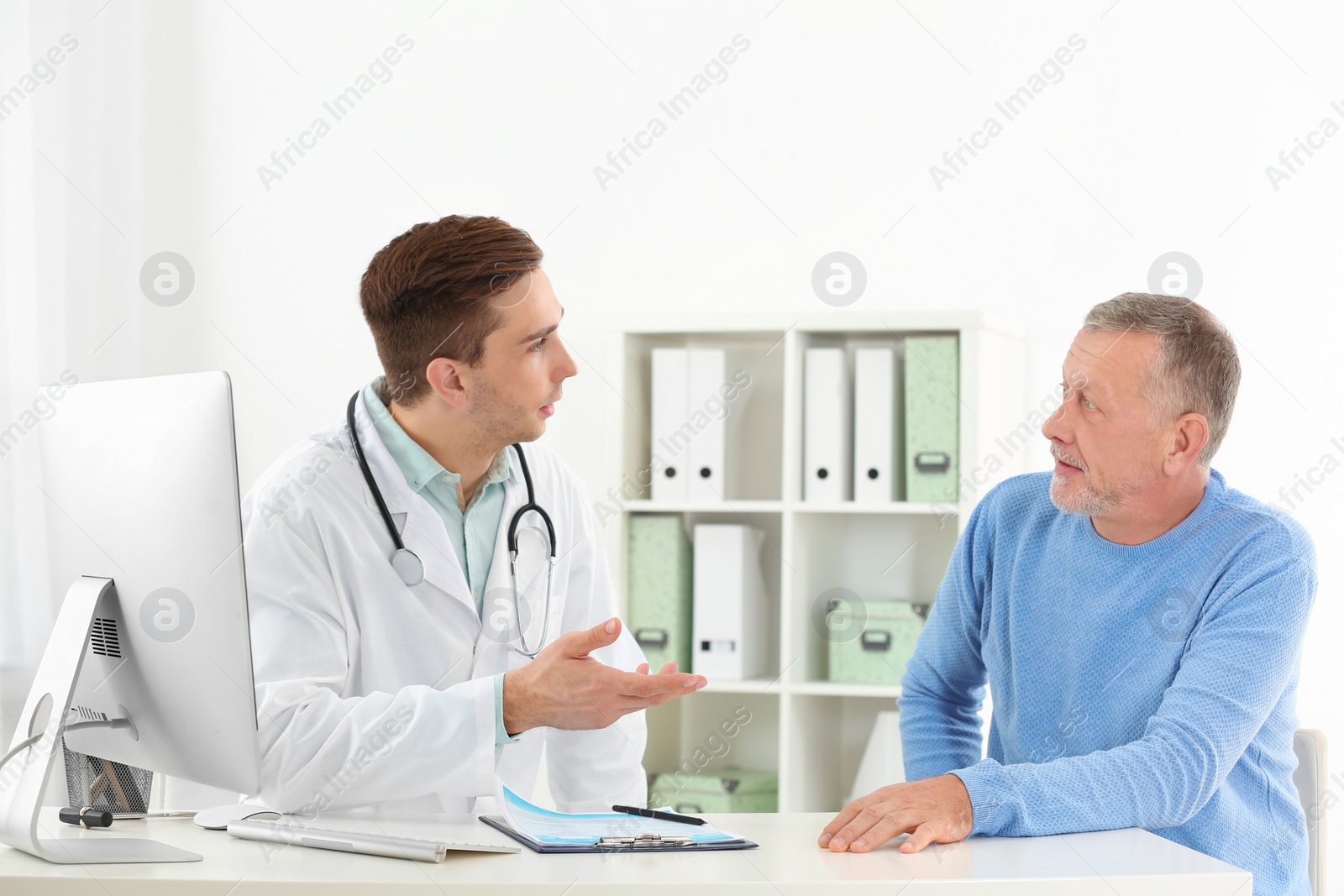 Photo of Doctor working with mature patient in hospital