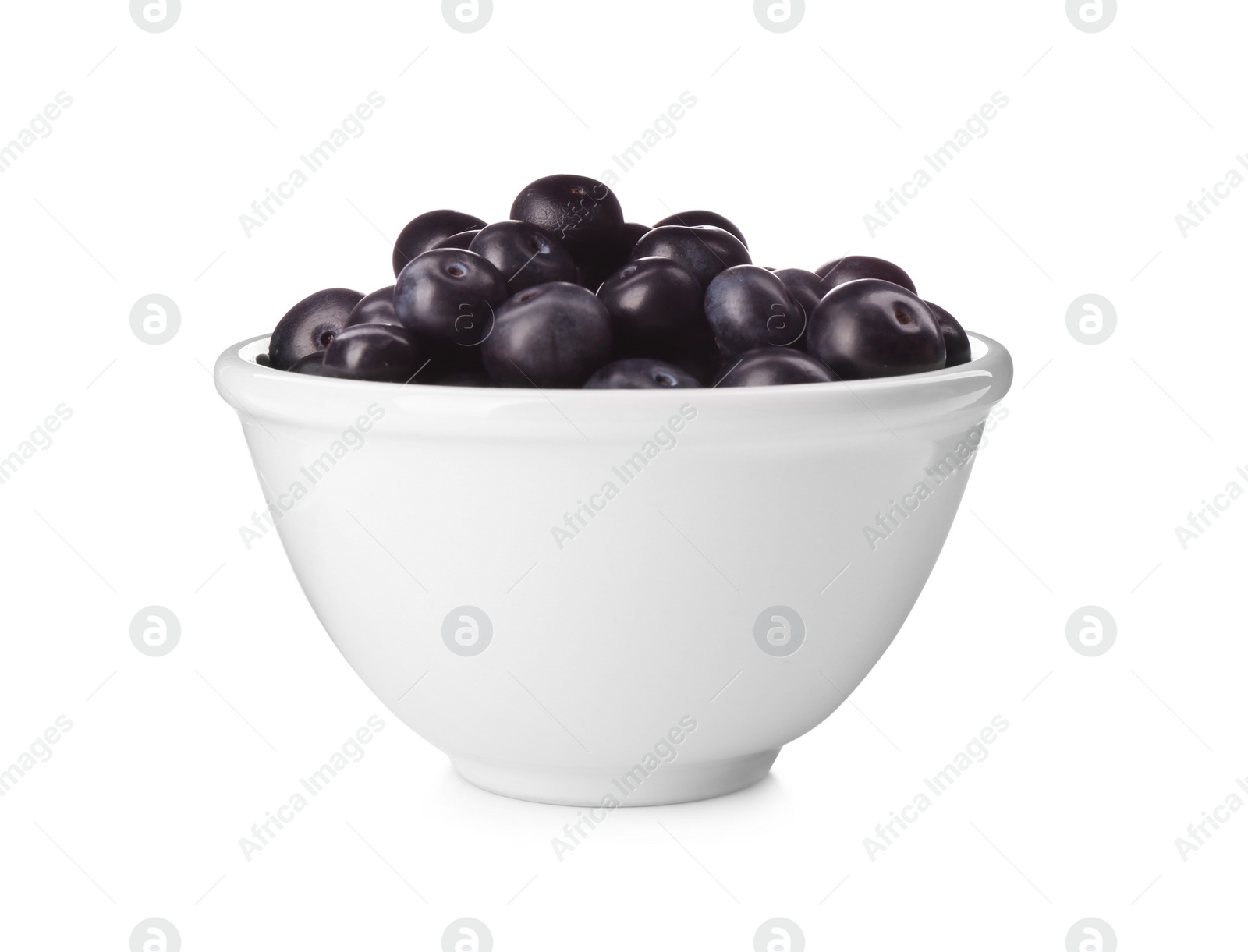 Photo of Fresh acai berries in bowl isolated on white