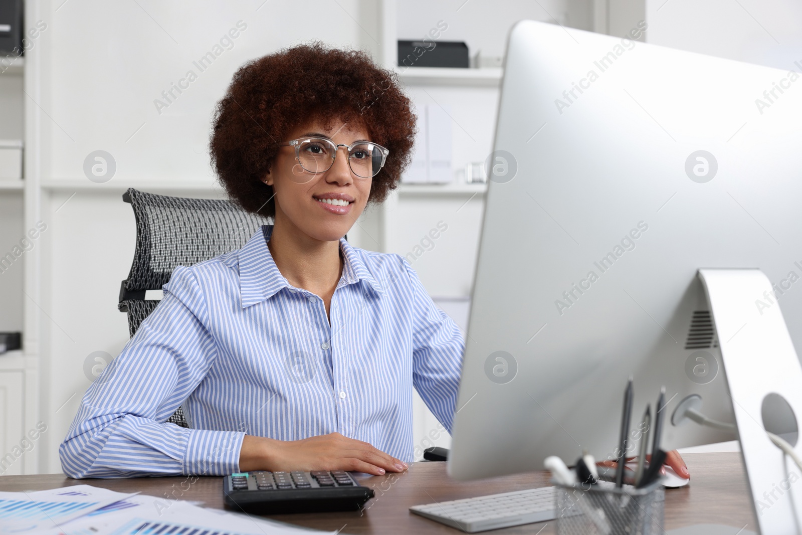 Photo of Professional accountant working on computer in office