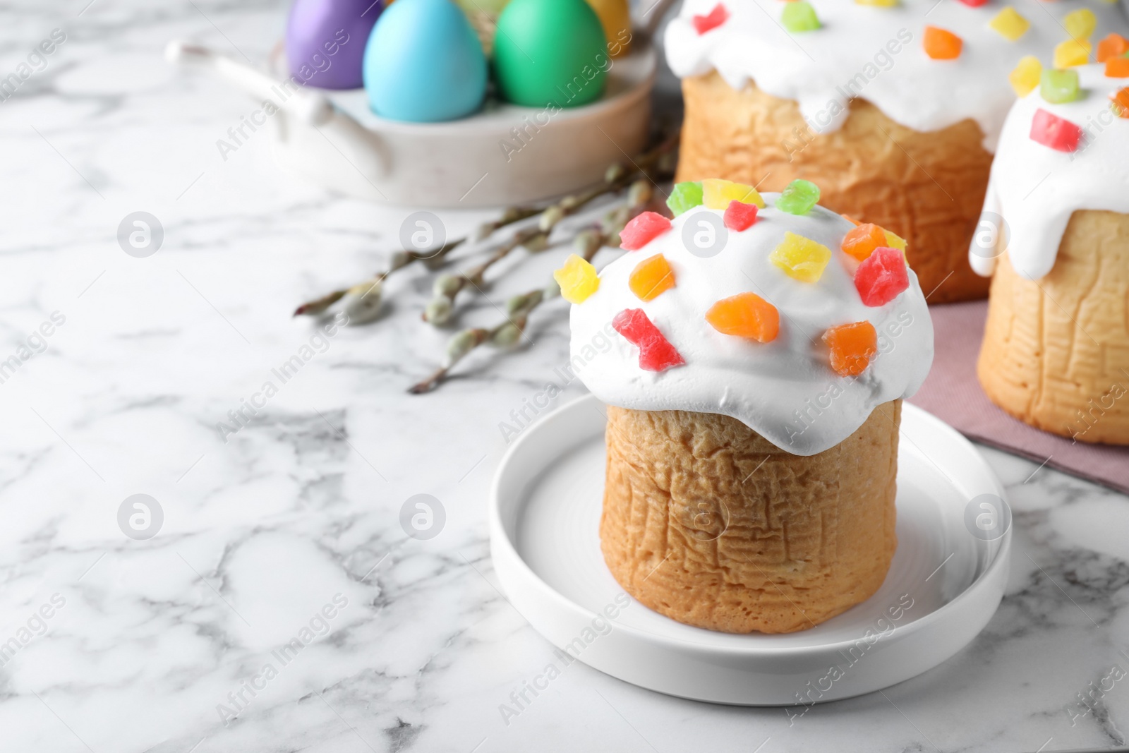 Photo of Beautiful Easter cake on white marble table. Space for text