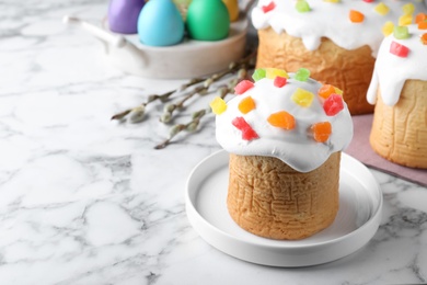 Beautiful Easter cake on white marble table. Space for text