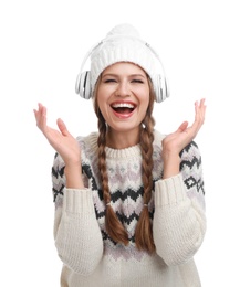 Young woman listening to music with headphones on white background