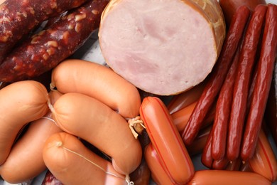 Photo of Different types of sausages on table, closeup
