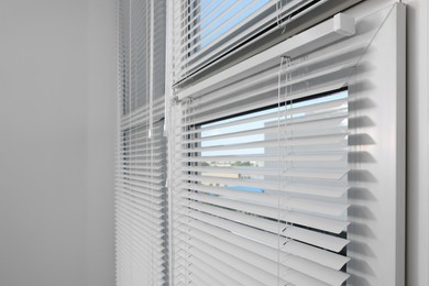 Photo of Window with horizontal blinds indoors, space for text