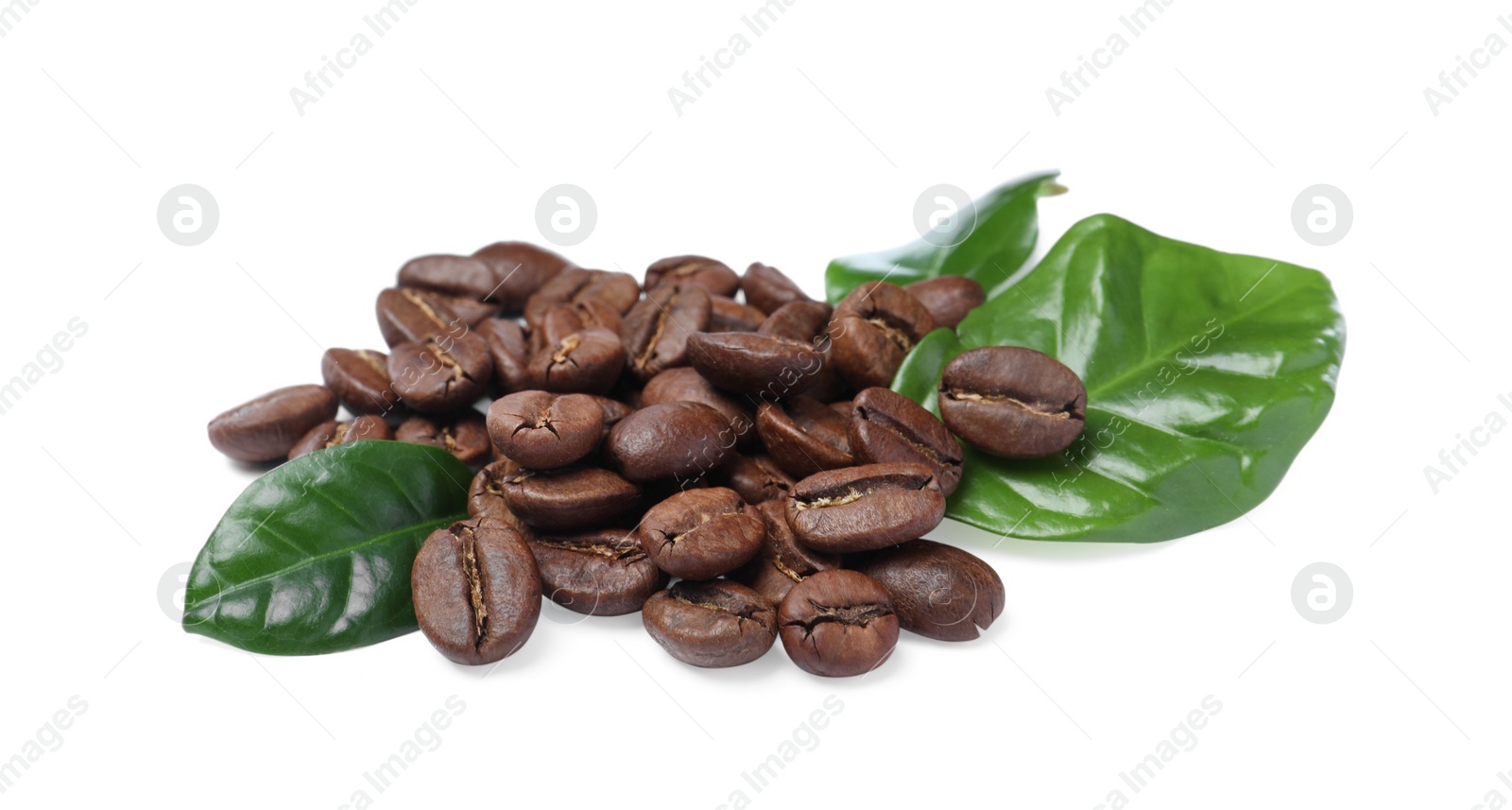 Photo of Pile of roasted coffee beans with fresh leaves on white background