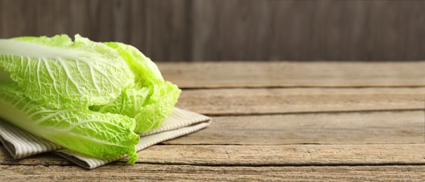 Image of Fresh ripe Chinese cabbage on wooden table, space for text. Banner design