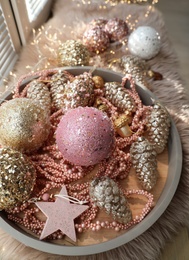 Photo of Beautiful Christmas tree baubles on window sill