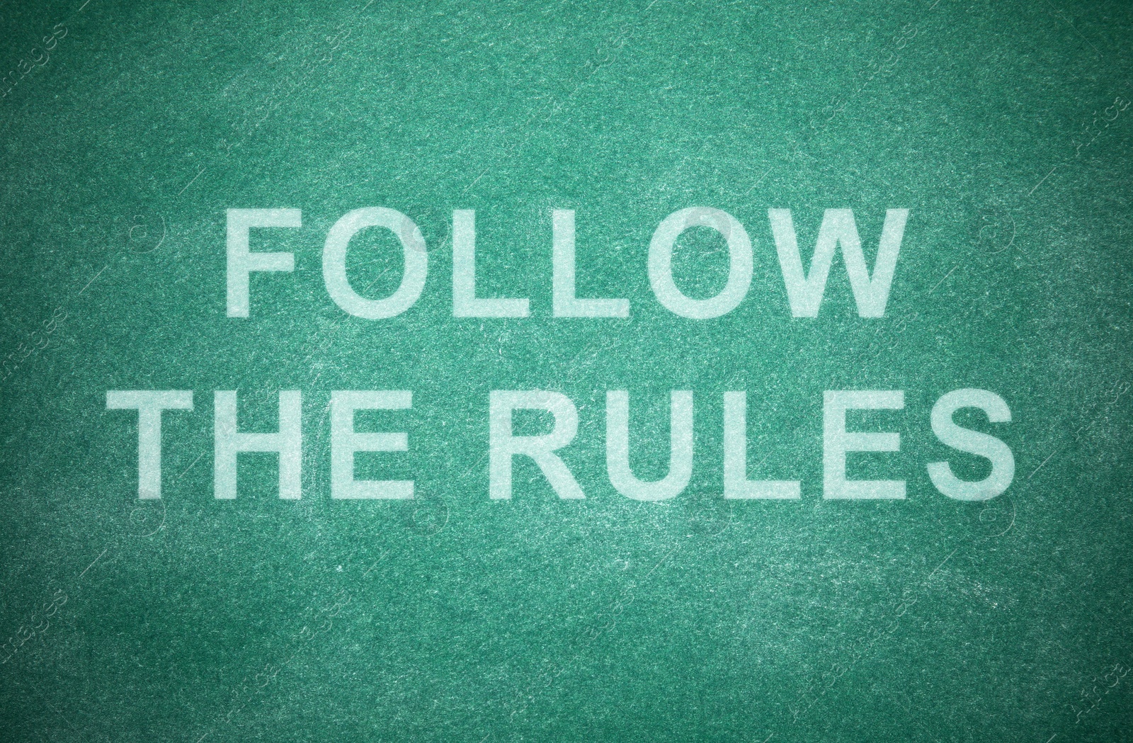 Illustration of Phrase Follow The Rules written on green chalkboard