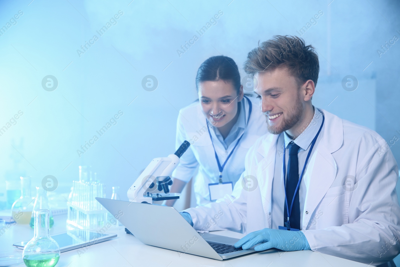 Photo of Scientists working in laboratory, space for text. Chemistry concept