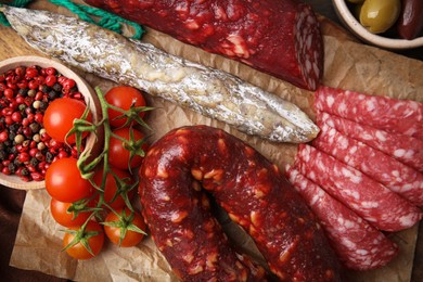 Different types of tasty sausages on table, flat lay