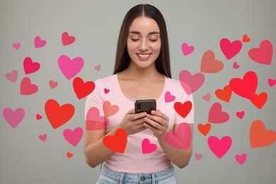 Long distance love. Woman chatting with sweetheart via smartphone on grey background. Hearts flying out of device and swirling around her