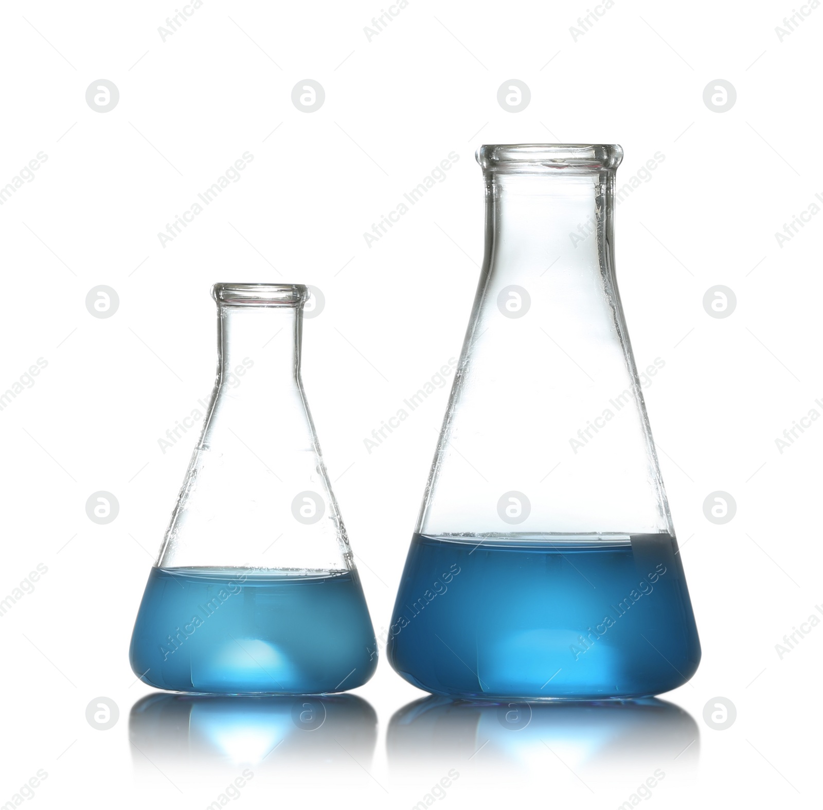 Photo of Conical flasks with liquid samples on white background. Chemistry glassware