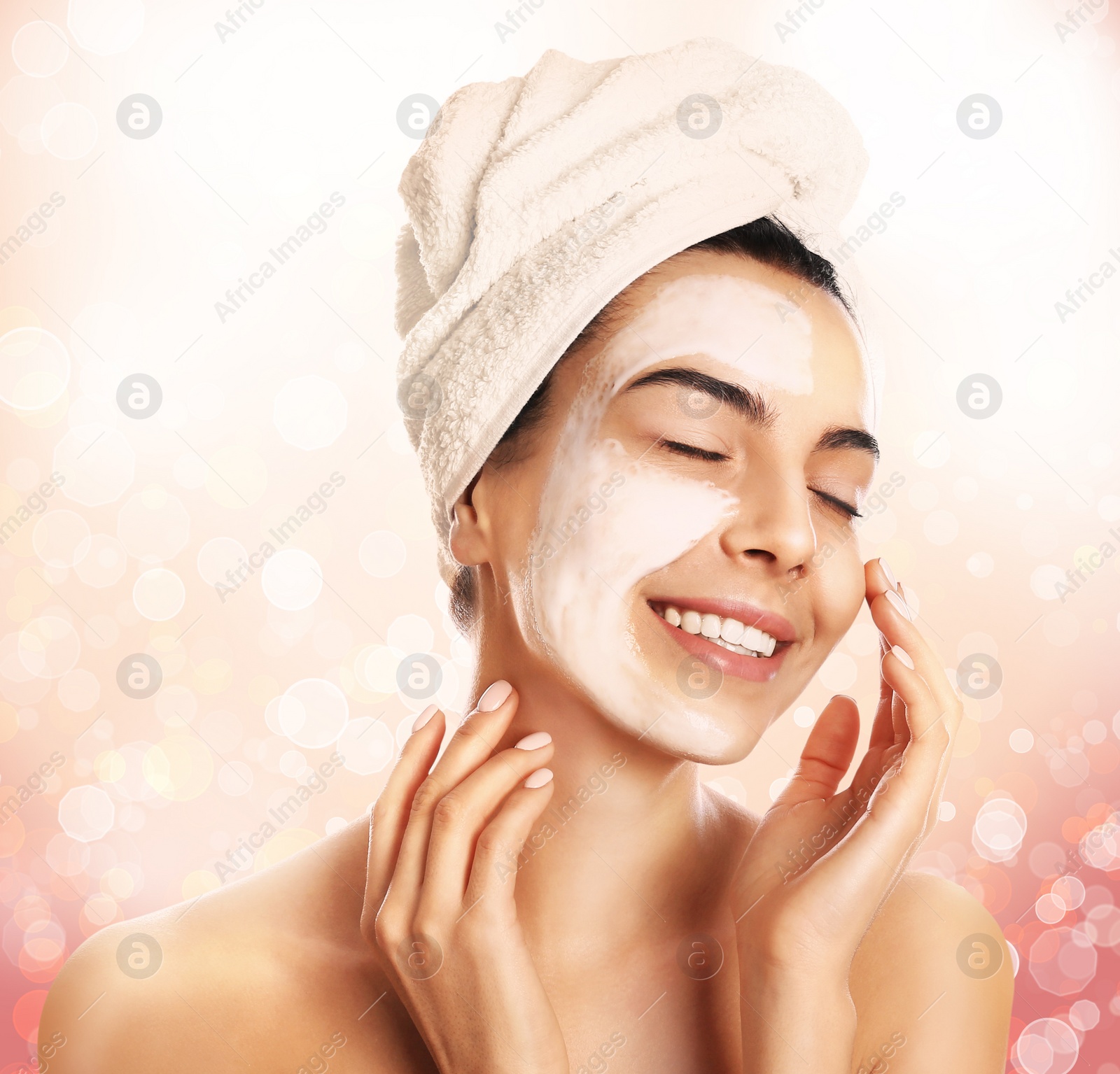 Image of Beautiful young woman with silky skin on light background. Spa treatment 