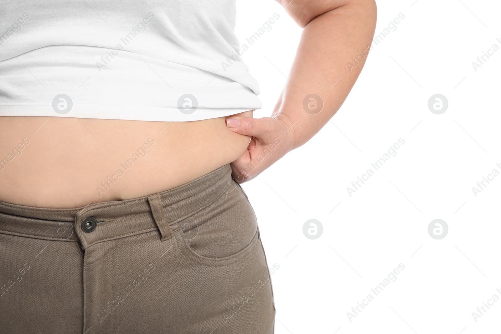 Photo of Overweight woman in tight shirt and trousers on white background, closeup