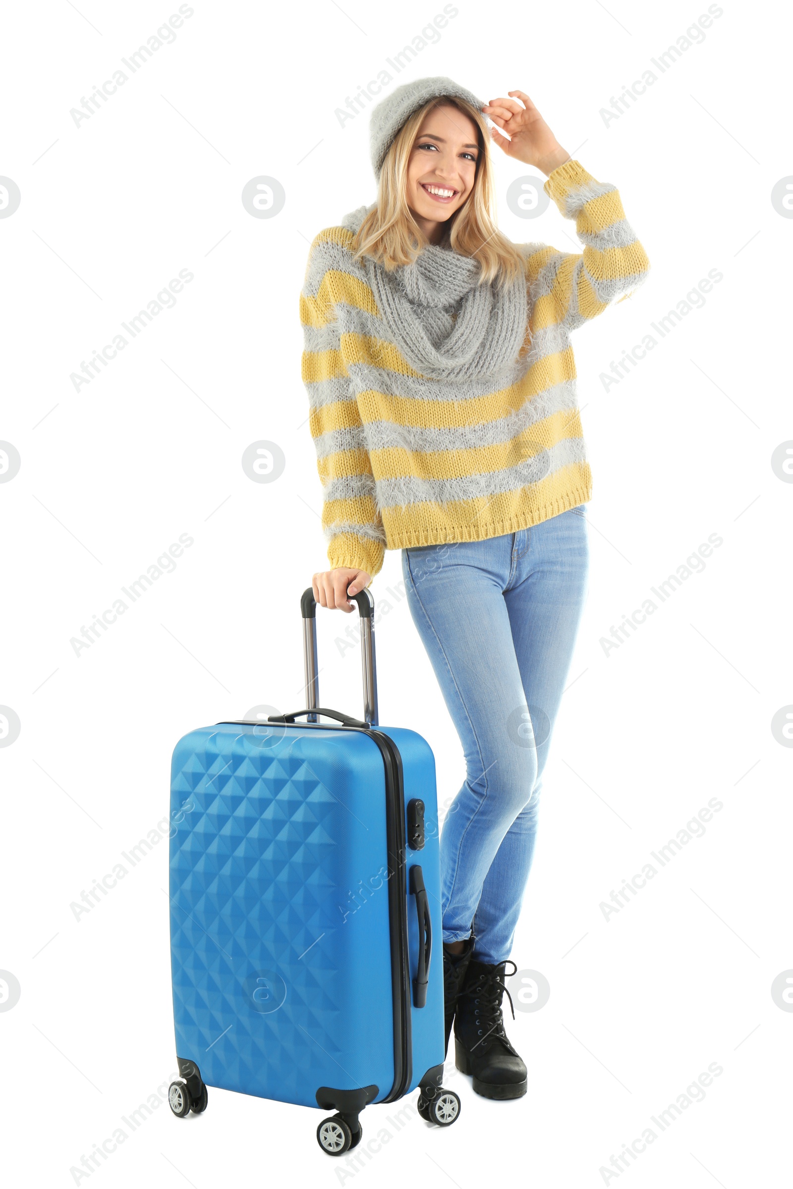 Photo of Young woman with suitcase on white background. Ready for winter vacation