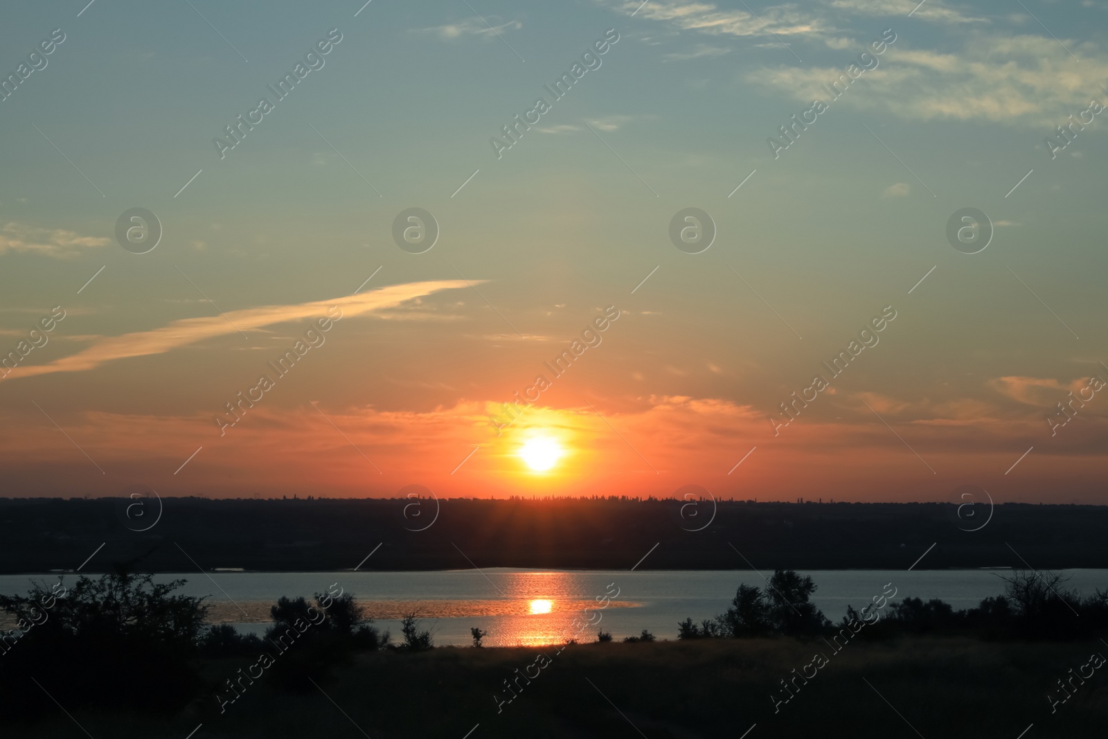 Photo of Picturesque view of tranquil river at sunrise